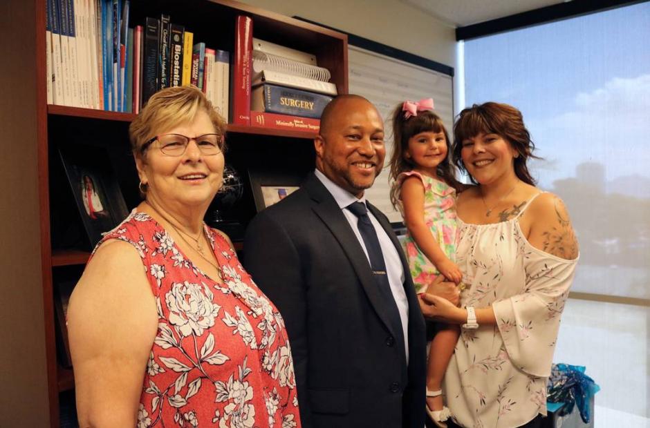 Dr. Randy St. Hill with patient Mary Duda and family
