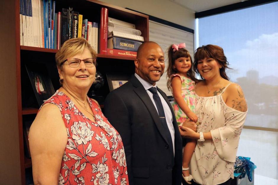 Dr. Randy St. Hill with patient Mary Duda and family
